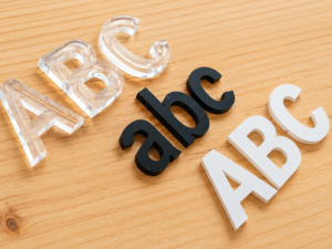Clear, black, and white acrylic cut letters showing different material, color, and thickness options for custom signage.