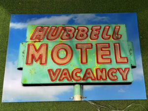 Custom LED neon sign with UV printed vintage motel sign artwork fabricated for hospitality and themed commercial environments.