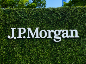 Custom waterproof reverse lit halo letters installed on a hedge wall for an outdoor corporate event branding display.