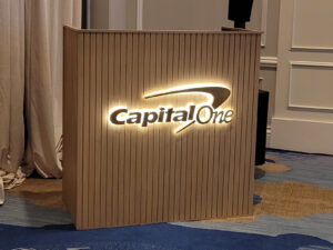 Custom reverse lit halo letters installed on a branded DJ booth for a corporate event.