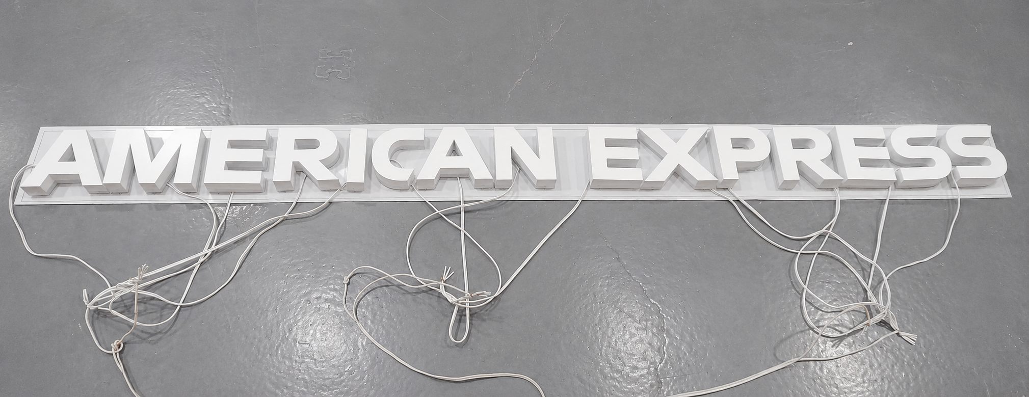 American Express halo-lit letters arranged in the production layout