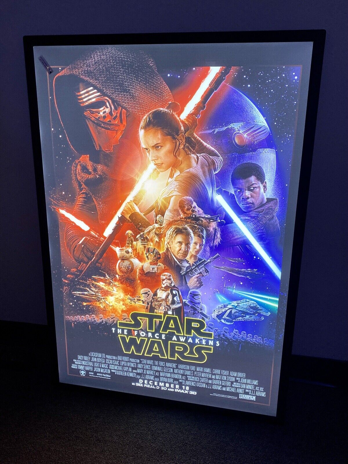 Backlit home cinema poster displayed in an LED snap frame