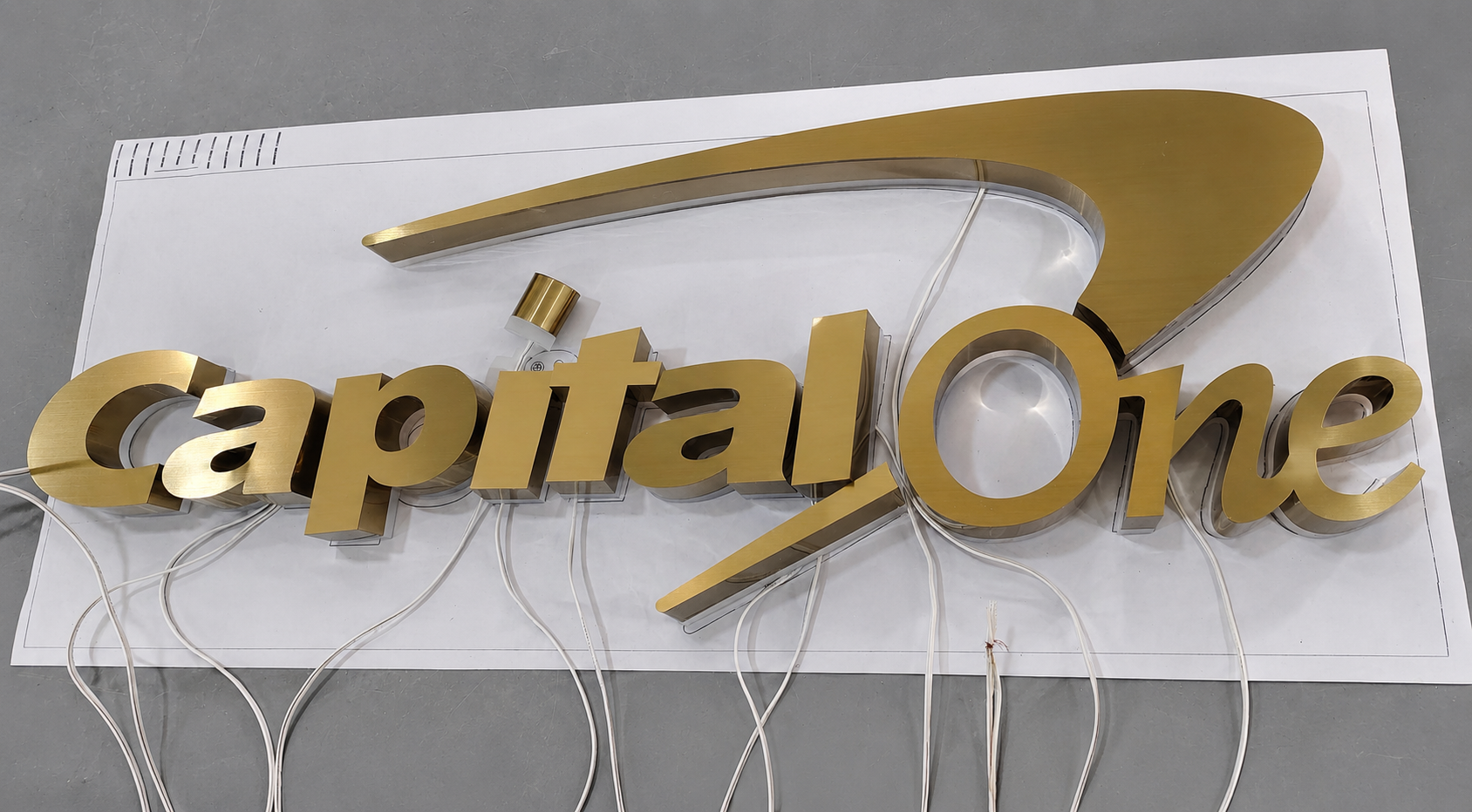 Capital One bronze-faced reverse-lit halo logo letters during fabrication