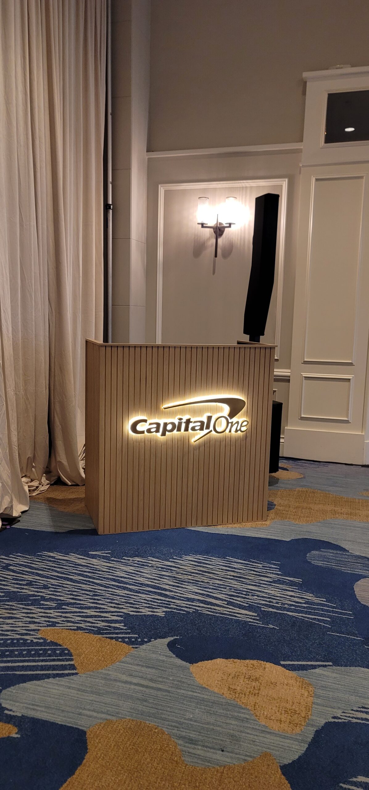Capital One halo-lit logo displayed on a DJ booth at a Los Angeles event