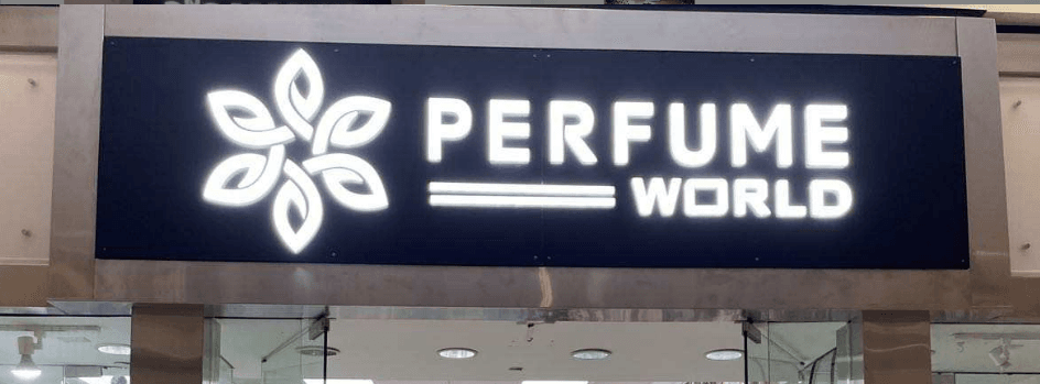 Perfume World storefront sign with illuminated white acrylic LED letters
