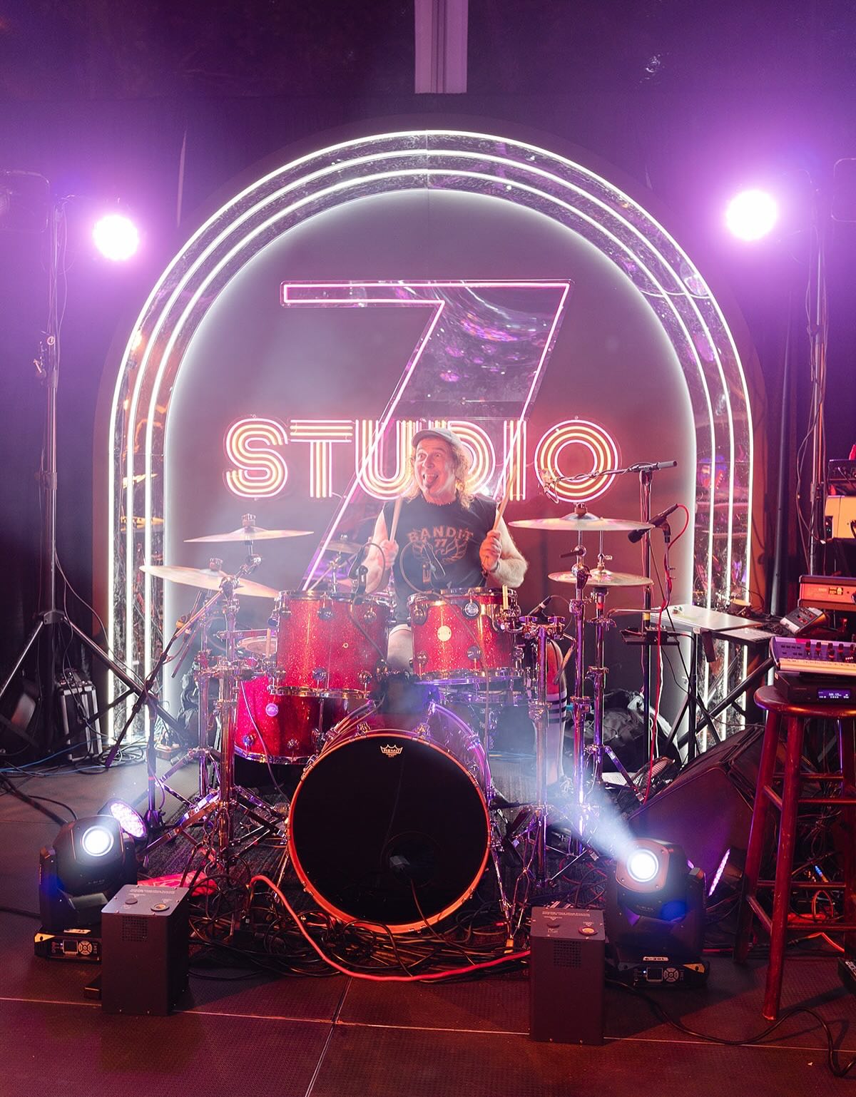 Custom Studio 7 LED neon sign with mirror backer displayed at a New York event