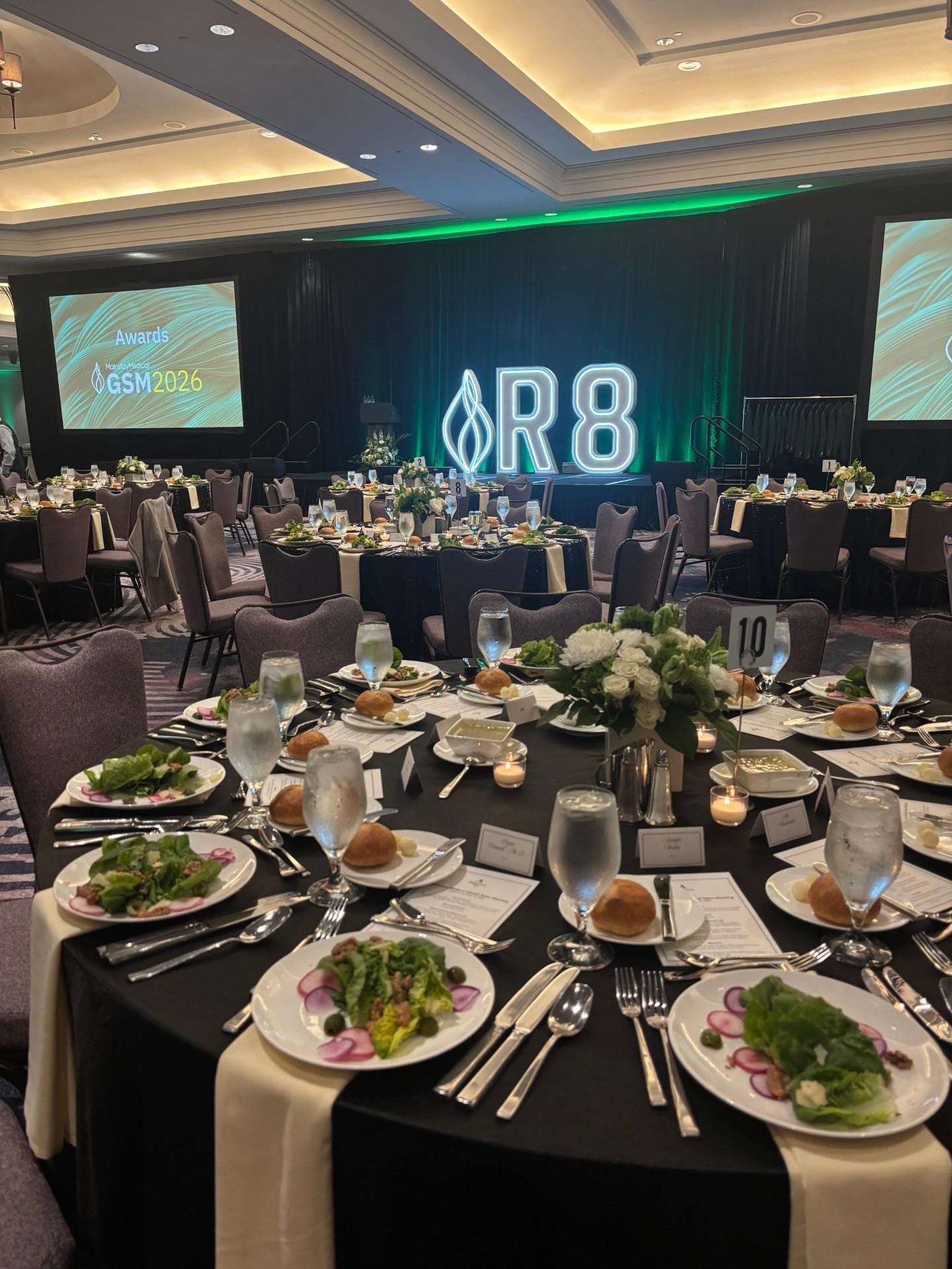 RGB pixel-chasing LED marquee on a medical company annual awards stage