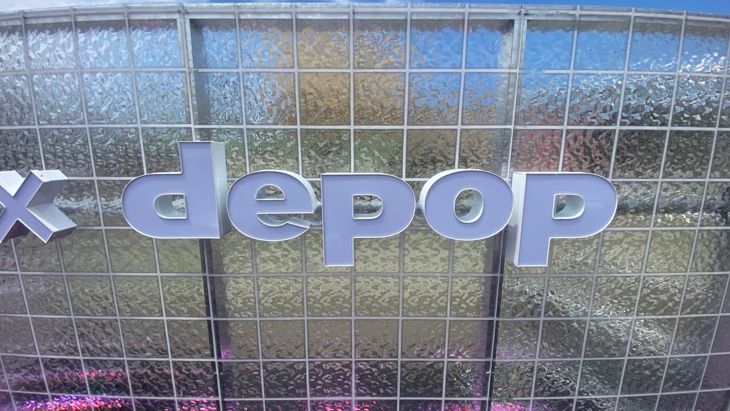 Close-up of Depop dimensional channel letters showing white faces and letter depth